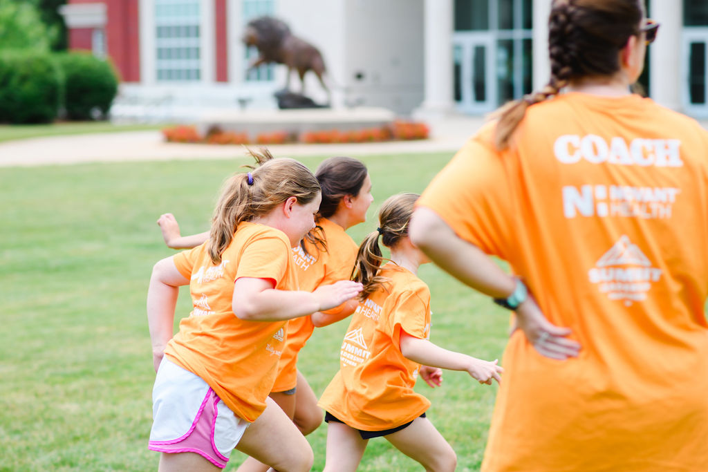 Girls running in field